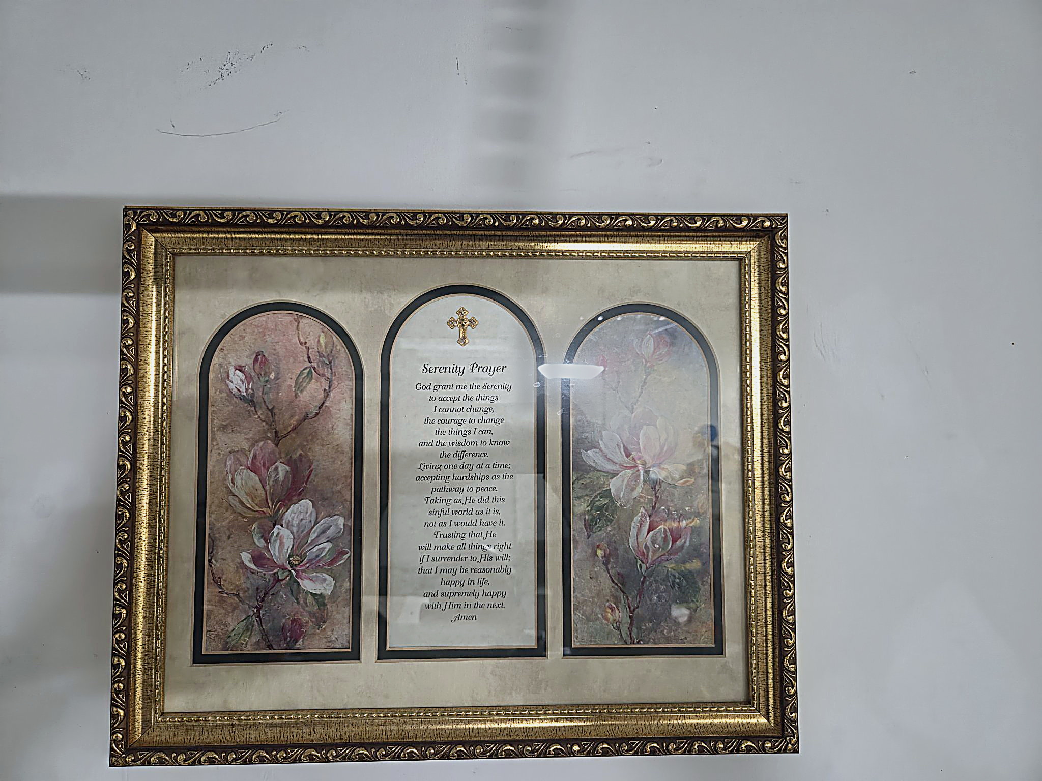 After — the same photograph: the glare on the glass repaired, the light and color set right, the Serenity Prayer lettering sharpened